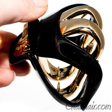 Load image into Gallery viewer, Black Octopus Shaped Plastic Hair Claw with Gold Teeth